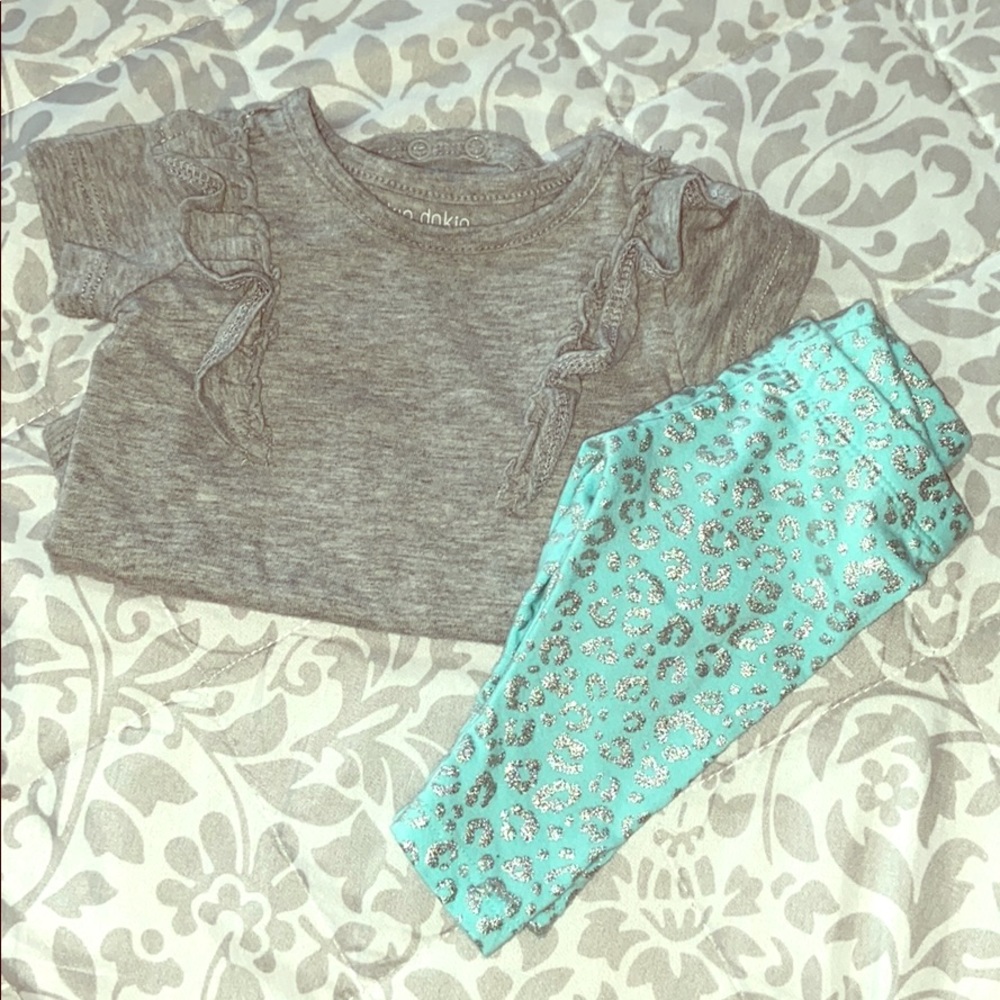Gray ruffle onesie with baby blue cheetah pants